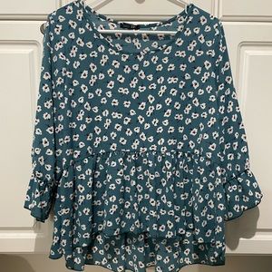 Women’s medium blouse teal with white floral print. Ruffles on sleeves
